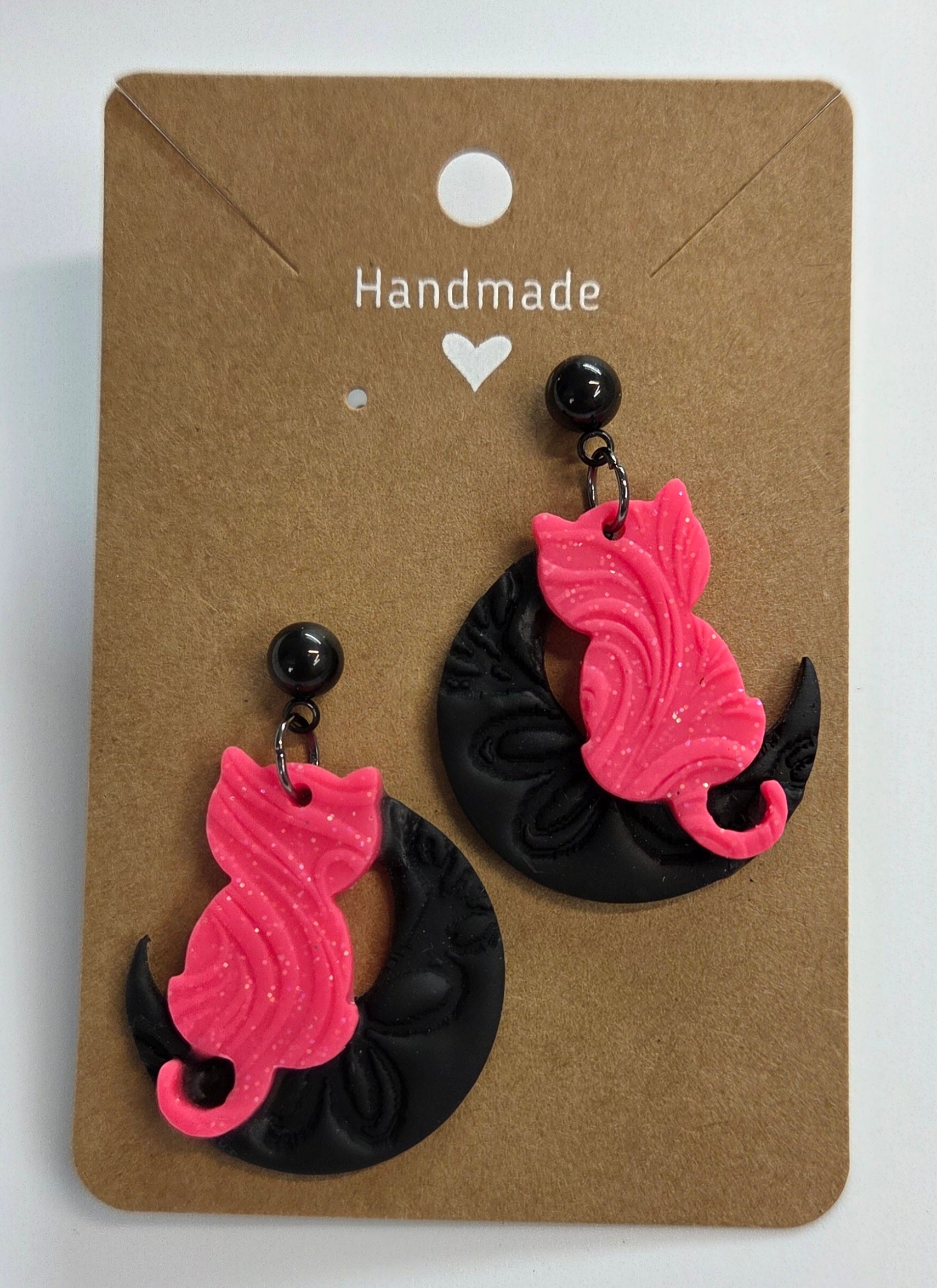 Pink Cat sitting on a Black moon Dangle Earring!