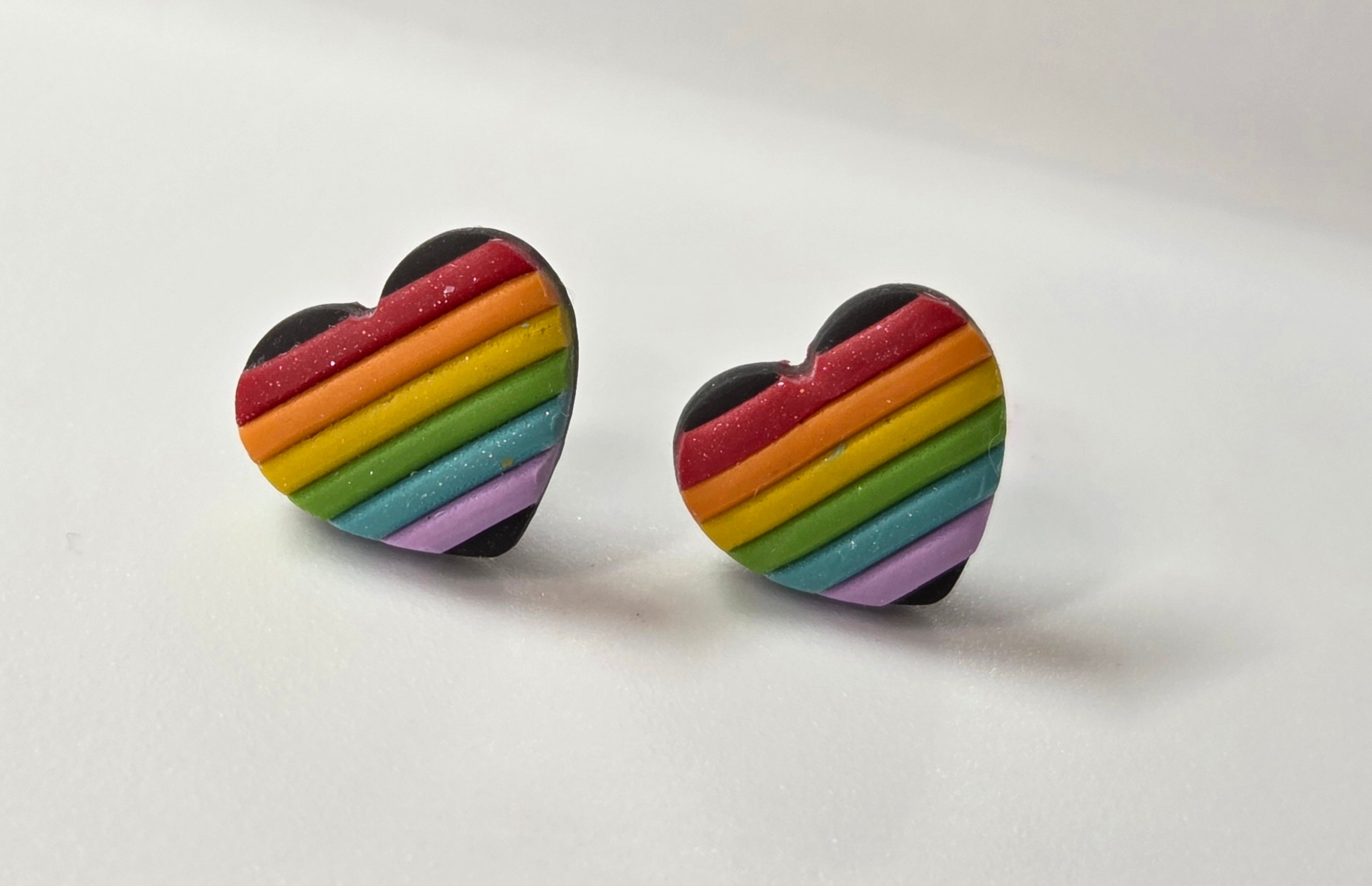 WHITE OR BLACK RAINBOW HEART STUD EARRINGS!